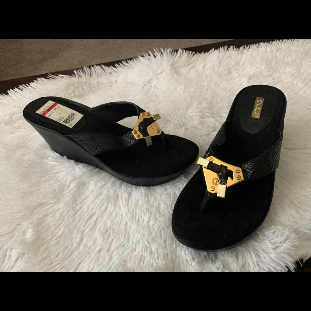 Black Guess wedge flip flops